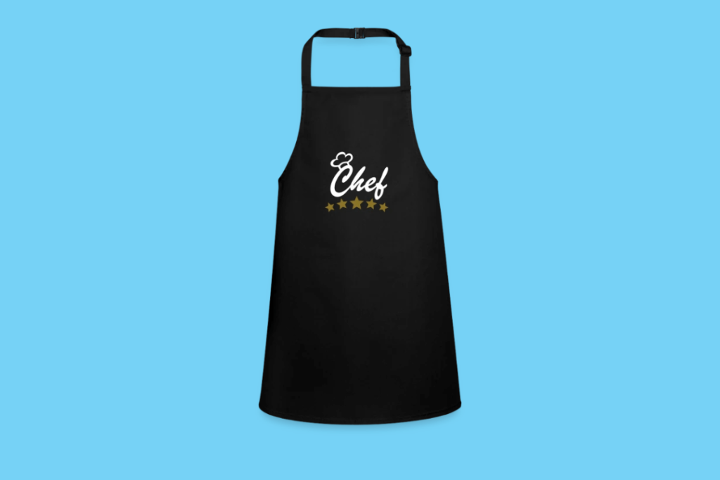 Een zwart schort met het woord 'chef' erop.